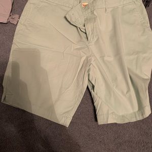 Green shorts the size is 1897% cotton/all gone down 3% spandex